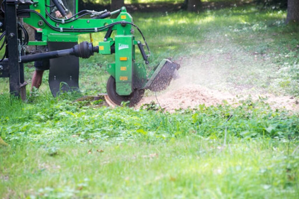 Professional stump grinding machine removing a tree stump below ground level during stump grinding and removal service in Wildwood, MO.